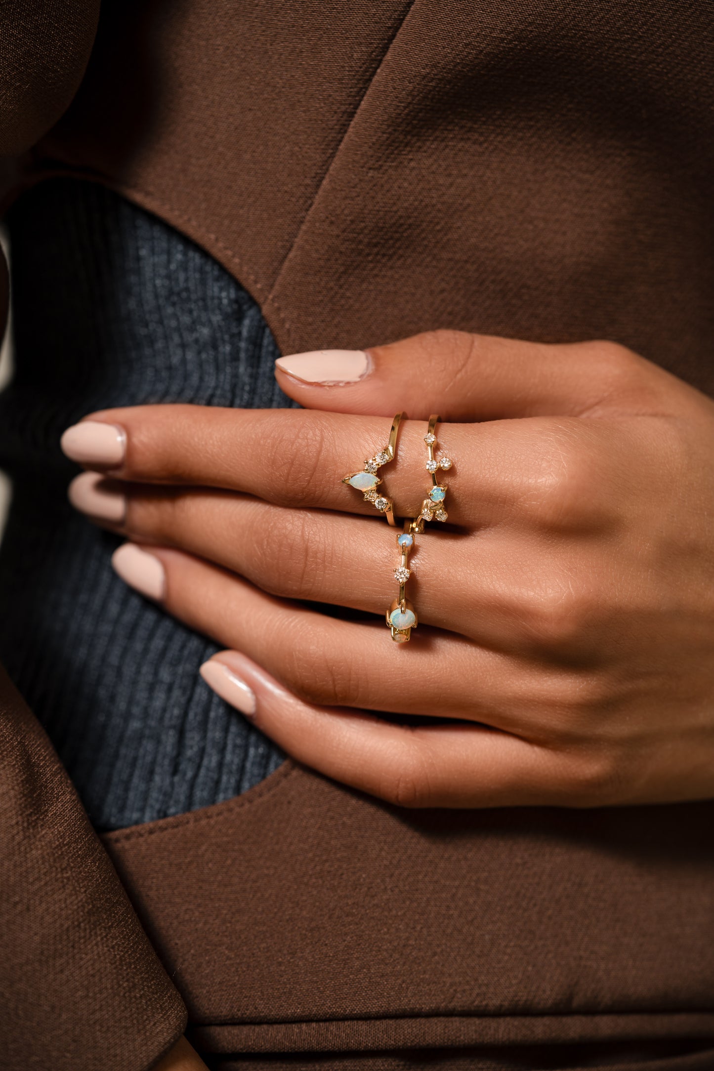 Single ring with three opals and diamond