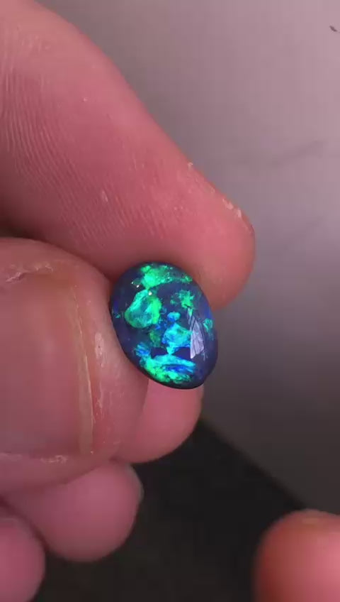 Australian black opal with blue and green play of color
