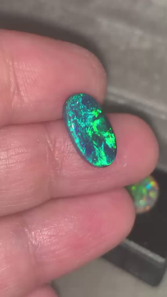 Black opal with green and blue play of color